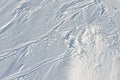 Snowy abstract off-piste skiing backround texture with ski and snowboard trails and tracks on new virgin powder snow Royalty Free Stock Photo