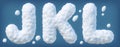 Snowy alphabet with letters J, K, L. Lettes made of snow. Winter font isolated on blue background