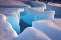 Snowy arctic landscape with ice cave shining in sun.