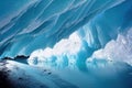 Snowy arctic landscape with ice cave shining in sun.