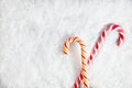 Snowy Background With Two Candy Canes