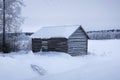 A snowy barn in a field Royalty Free Stock Photo