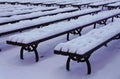 Snowy benches in city park