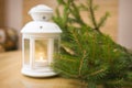 Snowy blue lantern and Christmas balls on the background of fir Royalty Free Stock Photo