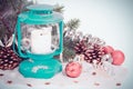Snowy blue lantern and Christmas balls on the background Royalty Free Stock Photo