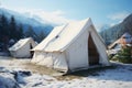 Snowy campsite White tents set in a mountain resort for winter