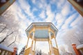 snowy canopy of gazebo against winter sky