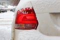 Snowy car tail light. Safety on winter roads Royalty Free Stock Photo