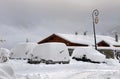 Snowy cars in a parking