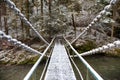 Snowy chain bridge over Hornad river in the Slovak Paradise Nati