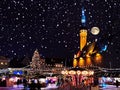 Snowy  Christmas night,holiday city moonlight night Tallinn old town hall square, best market place in Estonia, travel to Europe b Royalty Free Stock Photo