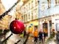 Snowy Christmas street life in the city ,green tree decorated with red balls and illumination,people walking  ,holiday travel to M Royalty Free Stock Photo
