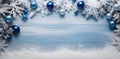 Snowy Christmas wooden background with blue and white baubles