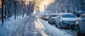 Snowy City Roads.Traffic jam on an Urban Street. Snow-Clad Vehicles and Icy Paths