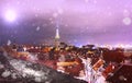 Snowy city  Tallinn winter in old town city light blurring old house medieval red roof tower travel to europe Royalty Free Stock Photo