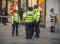 Snowy cold winter day bobbies gathering city centre london uk