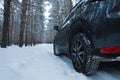 Snowy country road with car on winter day Royalty Free Stock Photo