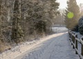 Snowy country road, winter landscape, winter road and snow-covered trees, winter in Latvia Royalty Free Stock Photo