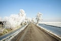 Snowy countryroad, in the Netherlands Royalty Free Stock Photo