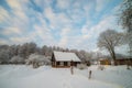 Snowy countryside of little wooden houses