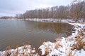 Snowy Cove on A Forested Lake