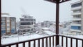 Snowy day in Denizli, Turkey, showcasing houses and traffic on the road