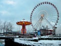 Snowy day at Navy Pier, Chicago with a lit Ferris wheel and carousel in view Royalty Free Stock Photo