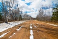 Snowy dirt road on a beautifully sunny winter day with bright blue skies with puffy clouds - in the Sax-Zim Bog nature area in Nor Royalty Free Stock Photo