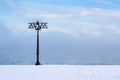 Snowy embankment along the misty river with lantern at the foggy morning - winter landscape. I