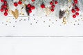 Snowy fir tree and Christmas decorations on white wooden table top view. Flat lay. Royalty Free Stock Photo