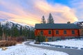 Snowy Footpath Rustic Wooden Alpine Log Cabin Snowy Mountain Peak Sunset Sky Colors Canmore Alberta Royalty Free Stock Photo