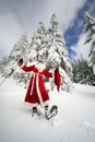 Santa Claus on snowshoes Royalty Free Stock Photo