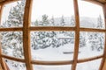 Snowy forest trees in the snow outside the window with a wooden Royalty Free Stock Photo