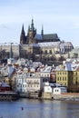 Snowy freeze Prague Lesser Town with gothic Castle above River Vltava, Czech republic