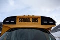 The snowy front of a school bus after a fresh winter snowfall Royalty Free Stock Photo