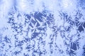 Snowy frosty pattern on a glass surface. Frost on the glass of the window. Frosty window. Snowflakes on the glass in winter. Royalty Free Stock Photo