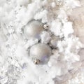 snowy frozen metallic iced background with silver balls coming out of it.New Year aesthetic