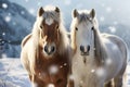 Snowy horses create a picturesque scene on a snowy backdrop