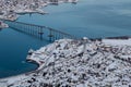 Snowy landascape and bridge over peaceful river in Tromso, Norway Royalty Free Stock Photo