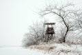 Snowy landscape with a hunting hide Royalty Free Stock Photo