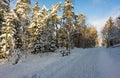 Snowy landscape. The park bench is covered with white thick snow. Royalty Free Stock Photo