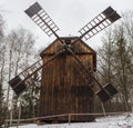 Snowy landscape with retro windmill