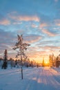 Snowy landscape at sunset, frozen trees in winter in Saariselka, Lapland Finland
