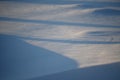 Snowy landscapes and snow close-up in sunbeams. Grass and objects in the snow