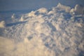 Snowy landscapes and snow close-up in sunbeams. Grass and objects in the snow