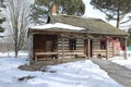 Snowy log cabin in the public park Royalty Free Stock Photo