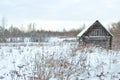 Winter hunting hut in the field Royalty Free Stock Photo