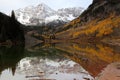 Maroon Bells reflected in the Maroon lake at sunrise in the Fall Royalty Free Stock Photo