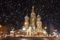 Snowy Moscow. St. Basil`s Cathedral on Red Square in snowfall. Night cityscape of Moscow, Russia Royalty Free Stock Photo