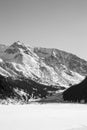 Snowy Mountain with brown rocks and clear sky.Black and White